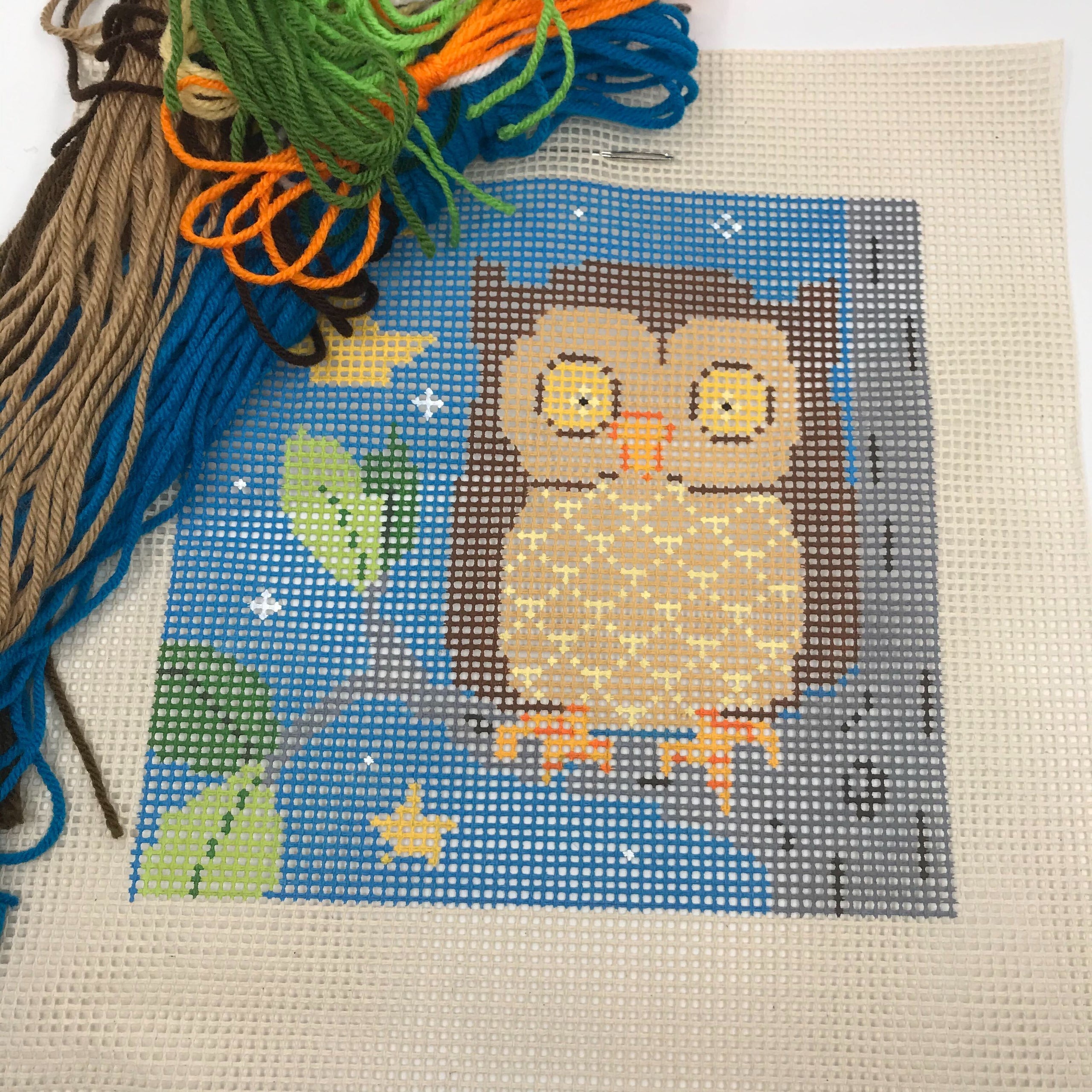A beginner needlepoint kit of an owl which is suitable for kids